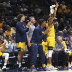 
              West Virginia players react from the bench during the first half of an NCAA college basketball game against Penn in Morgantown, W.Va., Friday, Nov. 18, 2022. (AP Photo/Kathleen Batten)
            