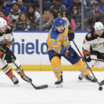 
              St. Louis Blues center Noel Acciari (52) works the puck against Anaheim Ducks' Troy Terry (19) and Jakob Silfverberg (33) during the second period of an NHL hockey game Monday, Nov. 21, 2022, in St. Louis. (AP Photo/Michael Thomas)
            