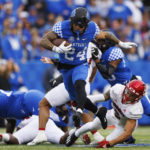 
              Kentucky running back Chris Rodriguez Jr. (24) evades a tackle during the first half of an NCAA college football game against Louisville in Lexington, Ky., Saturday, Nov. 26, 2022. (AP Photo/Michael Clubb)
            