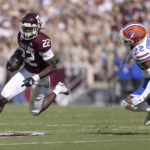 
              Texas A&M running back Le'Veon Moss (22) attempts to run past Florida safety Rashad Torrence II (22) during the first half of an NCAA college football game, Saturday, Nov. 5, 2022, in College Station, Texas. (Logan Hannigan-Downs/College Station Eagle via AP)
            