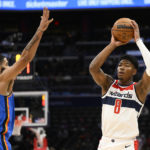 
              Washington Wizards forward Rui Hachimura (8) looks to pass against Oklahoma City Thunder forward Kenrich Williams (34) during the first half of an NBA basketball game, Wednesday, Nov. 16, 2022, in Washington. (AP Photo/Nick Wass)
            