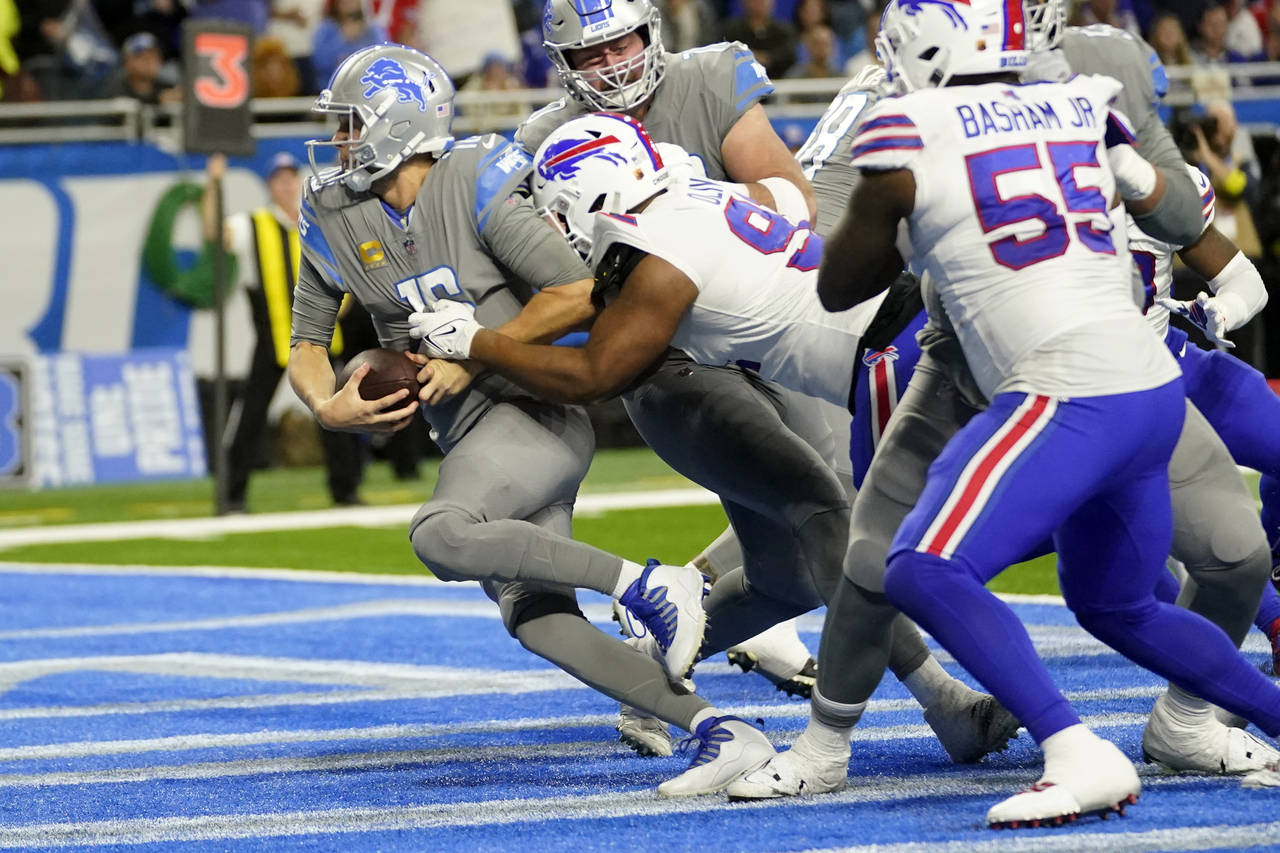 Detroit Lions quarterback Jared Goff (16) is tackled by Buffalo Bills defensive tackle Ed Oliver (9...