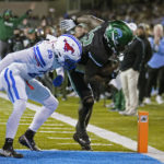 
              Tulane running back Tyjae Spears carries for a touchdown against Southern Methodist cornerback Sam Westfall (26) during the first half of an NCAA college football game in New Orleans, Thursday, Nov. 17, 2022. (AP Photo/Gerald Herbert)
            
