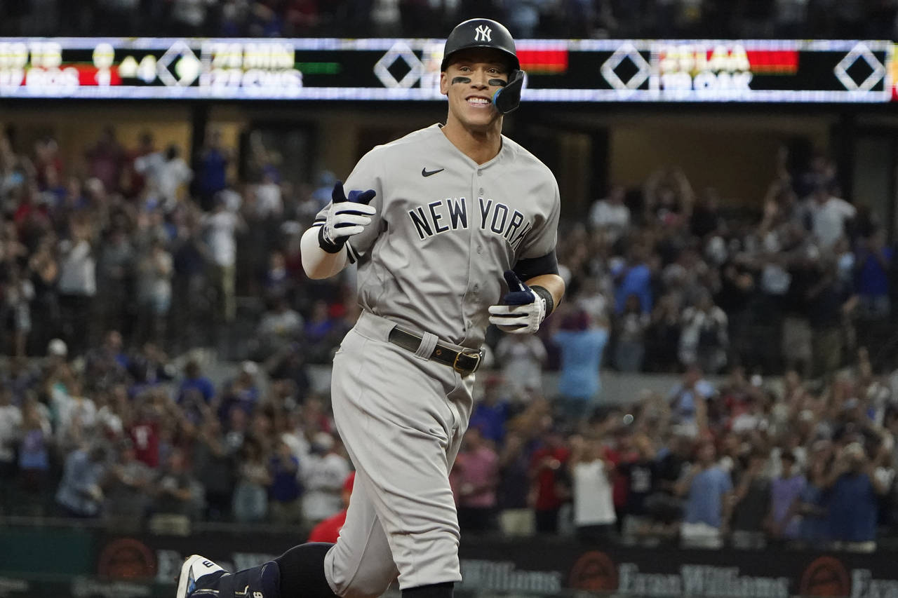 FILE -  New York Yankees' Aaron Judge gestures as he runs the bases after hitting a solo home run, ...