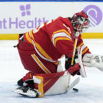 
              Calgary Flames goaltender Jacob Markstrom (25) makes a save on a shot by the Tampa Bay Lightning during the second period of an NHL hockey game Thursday, Nov. 17, 2022, in Tampa, Fla. (AP Photo/Chris O'Meara)
            