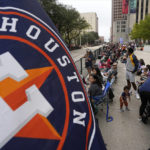 
              Fans wait for a victory parade for the Houston Astros' World Series baseball championship Monday, Nov. 7, 2022, in Houston. (AP Photo/David Phillip)
            