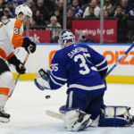 
              Toronto Maple Leafs goaltender Ilya Samsonov (35) makes a save as Philadelphia Flyers' Scott Laughton (21) watches during the first period of an NHL hockey game Wednesday, Nov. 2, 2022, in Toronto. (Frank Gunn/The Canadian Press via AP)
            