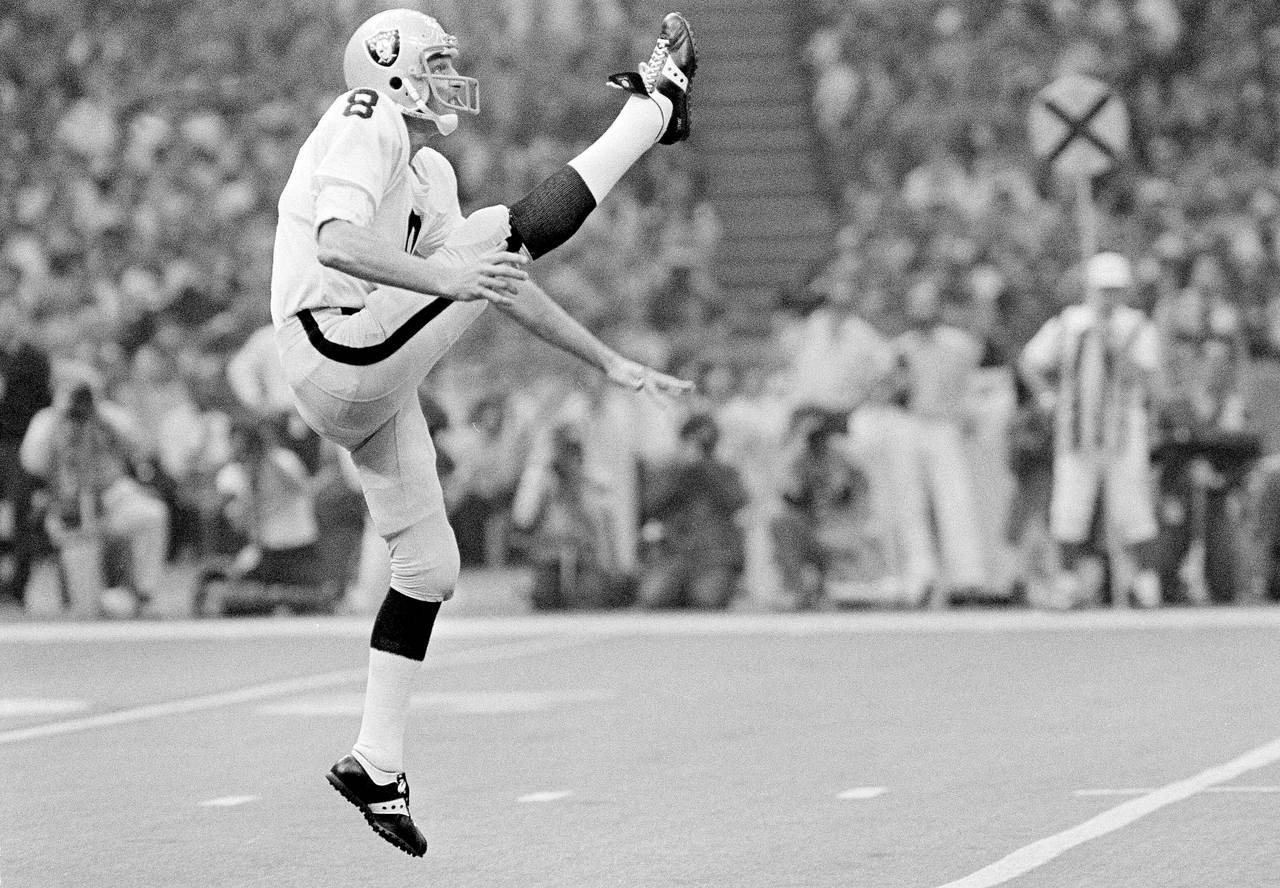 FILE - Oakland Raiders punter Ray Guy kicks during the Super Bowl at the Superdome in New Orleans, ...