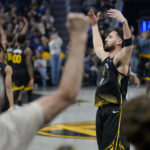 
              Golden State Warriors guard Klay Thompson gestures to fans after scoring against the Los Angeles Clippers during the first half of an NBA basketball game in San Francisco, Wednesday, Nov. 23, 2022. (AP Photo/Jeff Chiu)
            