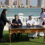 
              United States Secretary of State Antony Blinkin, center left, and Qatar Foreign Minister Mohammed Bin Adbulrahman Al Thani, center right, sign a letter of intent during a media event at the Diplomatic Club, in Tuesday, Nov. 22, 2022. America's top diplomat criticized a decision by FIFA to threaten players at the World Cup with yellow cards if they wear armbands supporting inclusion and diversity. (AP Photo/Ashley Landis)
            