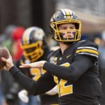 
              Missouri quarterback Brady Cook warms up before the start of an NCAA college football game against Kentucky Saturday, Nov. 5, 2022, in Columbia, Mo. (AP Photo/L.G. Patterson)
            