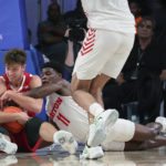 
              This photo provided by Bahamas Visual Services shows Wisconsin guard Carter Gilmore and Dayton guard Malachi Smnith (11) battle for the ball during an NCAA college basketball game at the Battle 4 Atlantis at Paradise Island, Bahamas, Wednesday, Nov. 23, 2022. . (Tim Aylen/Bahamas Visual Services via AP)
            