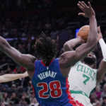 
              Boston Celtics guard Jaylen Brown (7) is fouled by Detroit Pistons center Isaiah Stewart (28) during first half of an NBA basketball game, Wednesday, Nov. 9, 2022, in Boston. (AP Photo/Charles Krupa)
            