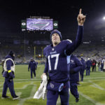 
              Tennessee Titans quarterback Ryan Tannehill (17) celebrates as he leaves the field after the team's NFL football game against the Green Bay Packers Thursday, Nov. 17, 2022, in Green Bay, Wis. (AP Photo/Mike Roemer)
            