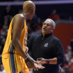 
              UMKC coach Marvin Menzies talks with Promise C. Idiaru during the second half of the team's NCAA college basketball game against Illinois on Friday, Nov. 11, 2022, in Champaign, Ill. (AP Photo/Michael Allio)
            