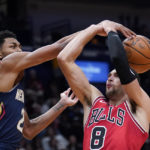 
              New Orleans Pelicans guard Trey Murphy III (25) blocks a shot by Chicago Bulls guard Zach LaVine (8) in the first half of an NBA basketball game in New Orleans, Wednesday, Nov. 16, 2022. (AP Photo/Gerald Herbert)
            