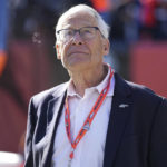 
              FILE - Denver Broncos owner Rob Walton waits for the team's NFL football game against the Las Vegas Raiders in Denver on Nov. 20, 2022. Inflation is not going to hurt the bankrolls of sports team owners. In fact, it may help. While the uber-rich will have to pay a little more for their eggs at the grocery store – just like everyone else – inflation is not likely to affect the bottom lines at their sports properties, whether it is yearly revenues or when it comes time to sell. (AP Photo/Jack Dempsey, File)
            