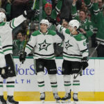 
              Dallas Stars left wing Jason Robertson (21) celebrates his goal against the Chicago Blackhawks with Colin Miller (6) and other teammates during the first period of an NHL hockey game in Dallas, Wednesday, Nov. 23, 2022. (AP Photo/LM Otero)
            