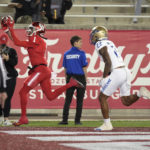 
              Houston wide receiver Nathaniel Dell (1) catches a touchdown pass against Tulsa safety LJ Wallace (22) during the first half of an NCAA college football game Saturday, Nov. 26, 2022, in Houston. (Karen Warren/Houston Chronicle via AP)
            