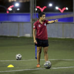 
              Insherah Heyasat, a football player, gives instructions during a training of the Orthodox Club's women's team in Amman, Jordan, Saturday, Oct. 22, 2022. Women's soccer has been long been neglected in the Middle East, a region that is mad for the men's game and hosts the World Cup for the first time this month in Qatar. (AP Photo/Raad AL-Adayleh)
            