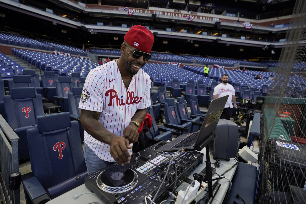 Everett DJ Hollywood plays music before Game 3 of baseball's World Series between the Houston Astro...
