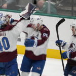 
              Colorado Avalanche goaltender Alexandar Georgiev (40) Mikko Rantanen (96) and Alex Newhook (18) celebrate after the Avalanche won 3-2 in a shootout in an NHL hockey game against the Dallas Stars Monday, Nov. 21, 2022, in Dallas. (AP Photo/Tony Gutierrez)
            