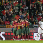 
              Portugal players celebrate after Bruno Fernandes scored the opening goal during an international friendly soccer match between Portugal and Nigeria at the Jose Alvalade stadium in Lisbon, Thursday, Nov. 17, 2022. The Portuguese team will leave for Qatar on Friday for the World Cup. (AP Photo/Armando Franca)
            