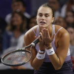 
              Aryna Sabalenka, of Belarus, reacts during her match against Caroline Garcia, of France, in the singles final of the WTA Finals tennis tournament in Fort Worth, Texas, Monday, Nov. 7, 2022. (AP Photo/Ron Jenkins)
            