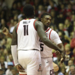 
              Arizona center Oumar Ballo (11) reacts with guard Cedric Henderson Jr., after he scored against San Diego State during the second half of an NCAA college basketball game, Tuesday, Nov. 22, 2022, in Lahaina, Hawaii. (AP Photo/Marco Garcia)
            
