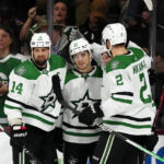 
              Dallas Stars center Wyatt Johnston (53) celebrates with left wing Jamie Benn (14), center Ty Dellandrea, back right, and defenseman Jani Hakanpaa (2) after his goal against the Arizona Coyotes during the first period of an NHL hockey game in Tempe, Ariz., Thursday, Nov. 3, 2022. (AP Photo/Ross D. Franklin)
            