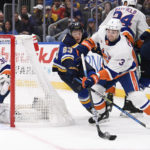 
              New York Islanders' Adam Pelech (3) controls the puck against St. Louis Blues' Jake Neighbours (63) during the second period of an NHL hockey game Thursday, Nov. 3, 2022, in St. Louis. (AP Photo/Jeff Le)
            