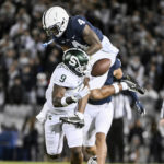 
              Penn State cornerback Kalen King (4) breaks up a pass intended for Michigan State tight end Daniel Barker (9) during the first half of an NCAA college football game, Saturday, Nov. 26, 2022, in State College, Pa. (AP Photo/Barry Reeger)
            