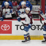 
              Colorado Avalanche center Andrew Cogliano (11) and defenseman Jacob MacDonald (26) are congratulated after an Avalanche goal against the Washington Capitals during the third period of an NHL hockey game Saturday, Nov. 19, 2022, in Washington. The Avalanche won 4-0. (AP Photo/Jess Rapfogel)
            