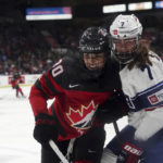 
              Canada's Sarah Nurse (20) and United States' Clair DeGeorge (7) work near the boards during the second period of a Rivalry Series hockey game Tuesday, Nov. 15, 2022, in Kelowna, British Columbia. (Jesse Johnston/The Canadian Press via AP)
            
