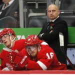 
              Detroit Red Wings coach Derek Lalonde along with left wing Lucas Raymond (23) and center Andrew Copp (18) watch the final minutes of an 8-2 loss to the New York Rangers in an NHL hockey game Thursday, Nov. 10, 2022, in Detroit. (AP Photo/Duane Burleson)
            
