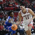 
              Louisiana Tech forward Isaiah Crawford pushes the ball away from Texas Tech forward Daniel Batcho (12) during the first half of an NCAA college basketball game, Monday, Nov. 14, 2022, in Lubbock, Texas. (AP Photo/Justin Rex)
            