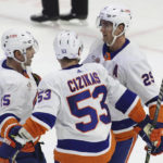 
              New York Islanders' Brock Nelson (29) celebrates after his empty-net goal with teammates Cal Clutterbuck (15) and Casey Cizikas (53) during third-period NHL hockey game action against the Ottawa Senators in Ottawa, Ontario, Monday, Nov. 14, 2022. (Patrick Doyle/The Canadian Press via AP)
            