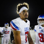 
              Los Alamitos High School quarterback Malachi Nelson stands on the field after a high school football game against Newport Harbor High School on Friday, Sept. 30, 2022, in Newport Beach, Calif. (AP Photo/Ashley Landis)
            