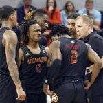 
              Winthrop coach Mark Prosser talks to players during the second half of the team's NCAA college basketball game against Auburn on Tuesday, Nov. 15, 2022, in Auburn, Ala. (AP Photo/Butch Dill)
            