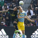 
              Los Angeles FC forward Cristian Arango (9) and Philadelphia Union defender Jack Elliott (3) battle for the ball in the first half during the MLS Cup soccer match Saturday, Nov. 5, 2022, in Los Angeles. (AP Photo/Marcio Jose Sanchez)
            