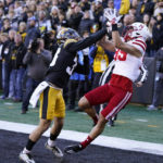 
              Iowa defensive back Riley Moss, left, breaks up a pass intended for Nebraska wide receiver Oliver Martin (89) during the first half of an NCAA college football game, Friday, Nov. 25, 2022, in Iowa City, Iowa. (AP Photo/Charlie Neibergall)
            