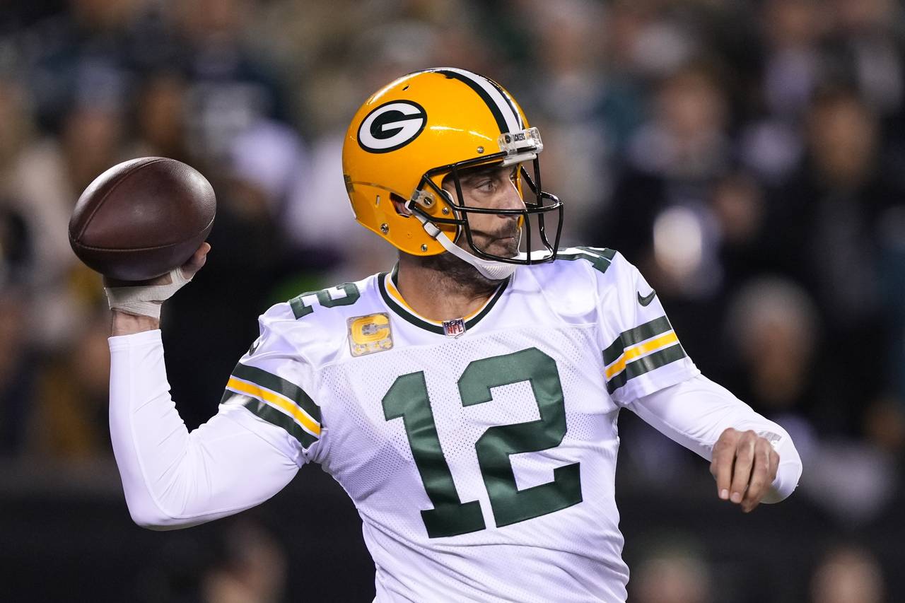 Green Bay Packers quarterback Aaron Rodgers throws during the first half of an NFL football game ag...