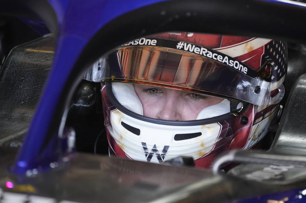 Williams test driver Logan Sargeant sits in his car during the first practice session for the Formu...