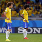 
              FILE - Brazil's David Luiz, left, and Dante react after Germany scored their sixth goal during the World Cup semifinal soccer match between Brazil and Germany at the Mineirao Stadium in Belo Horizonte, Brazil, Tuesday, July 8, 2014. (AP Photo/Frank Augstein, File)
            