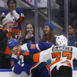 
              New York Islanders right wing Oliver Wahlstrom, left, and Philadelphia Flyers defenseman Tony DeAngelo fight in front of some fans in the third period of an NHL hockey game Saturday, Nov. 26, 2022, in Elmont, N.Y. (AP Photo/John Munson)
            