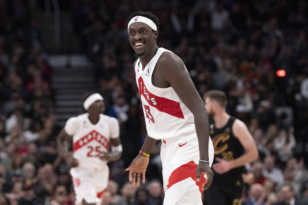 Toronto Raptors' Pascal Siakam reacts after teammate O.G. Anunoby hit a three point shot during the...