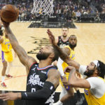 
              Los Angeles Clippers forward Marcus Morris Sr., left, shoots as Los Angeles Lakers forward Anthony Davis defends during the first half of an NBA basketball game Wednesday, Nov. 9, 2022, in Los Angeles. (AP Photo/Mark J. Terrill)
            