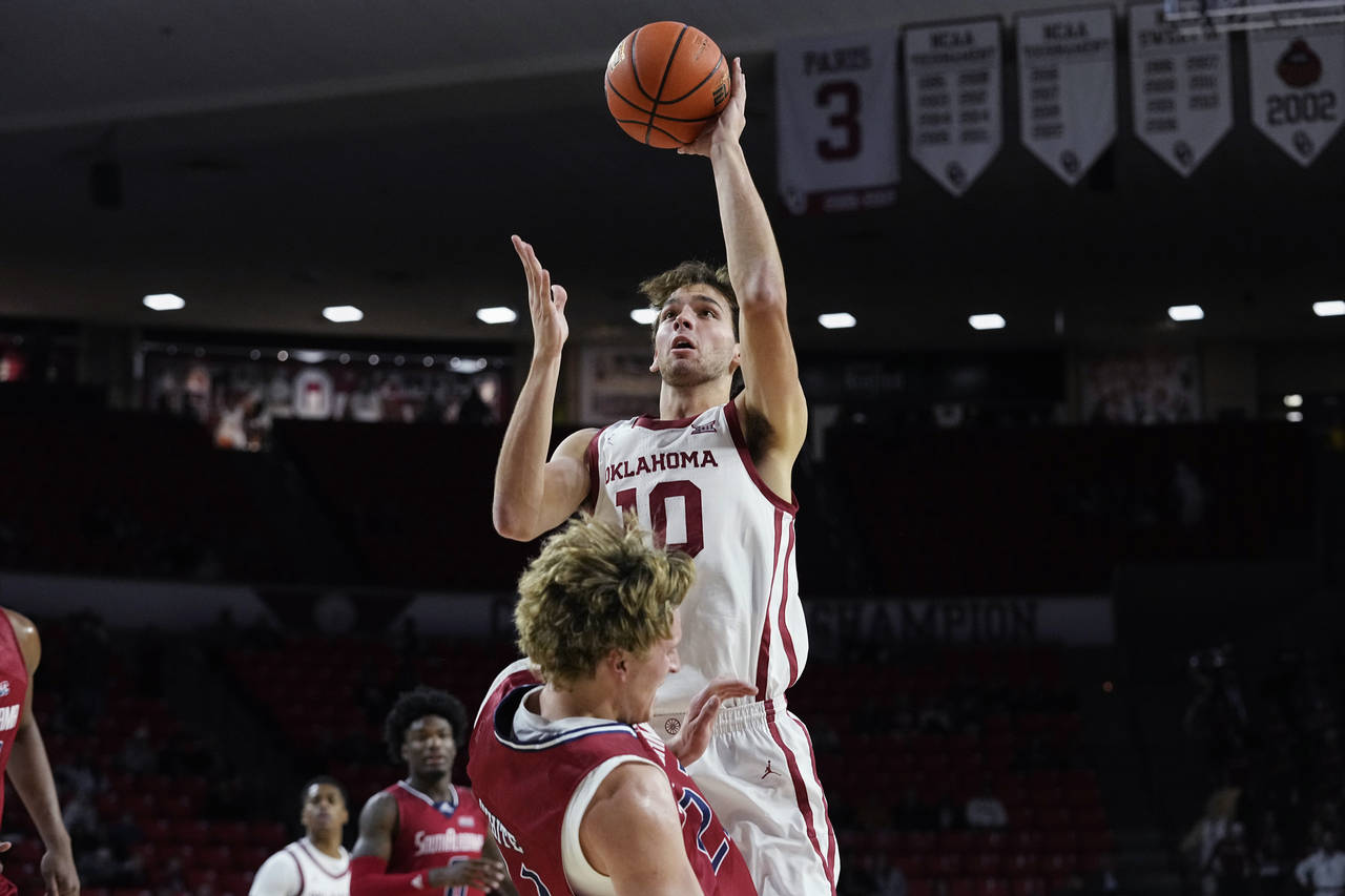 Oklahoma forward Sam Godwin (10) collides with South Alabama guard Owen White during the second hal...