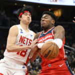 
              Washington Wizards forward Rui Hachimura, right, loses the ball to Brooklyn Nets forward Yuta Watanabe (18) during the first half of an NBA basketball game Friday, Nov. 4, 2022, in Washington. (AP Photo/Nick Wass)
            