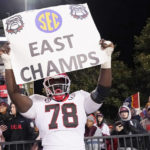 
              Georgia defensive lineman Nazir Stackhouse (78) hoists a sign after his team defeated Mississippi State in an NCAA college football game in Starkville, Miss., Saturday, Nov. 12, 2022. (AP Photo/Rogelio V. Solis)
            